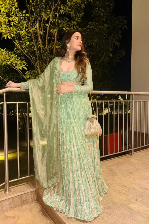 Nupur sanon in a sea green metallic drape embelished saree set