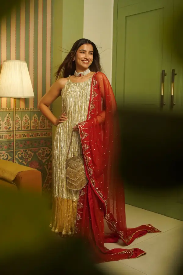Kinjal Bhanushali in a shades of gokd ombre anarkali and a tulle mukaish dupatta