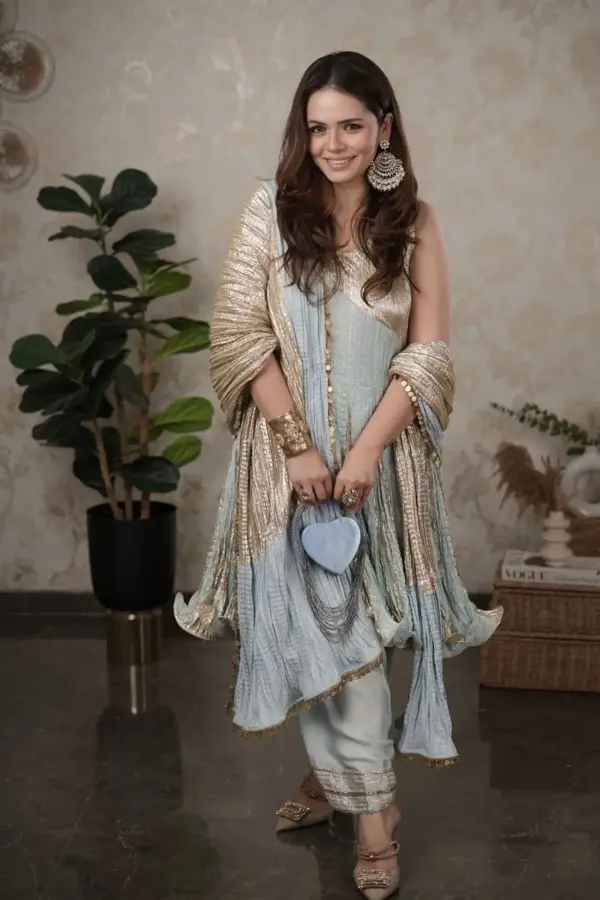 Hena Somani in an Ice blue crinkled flared short kurta salwar set